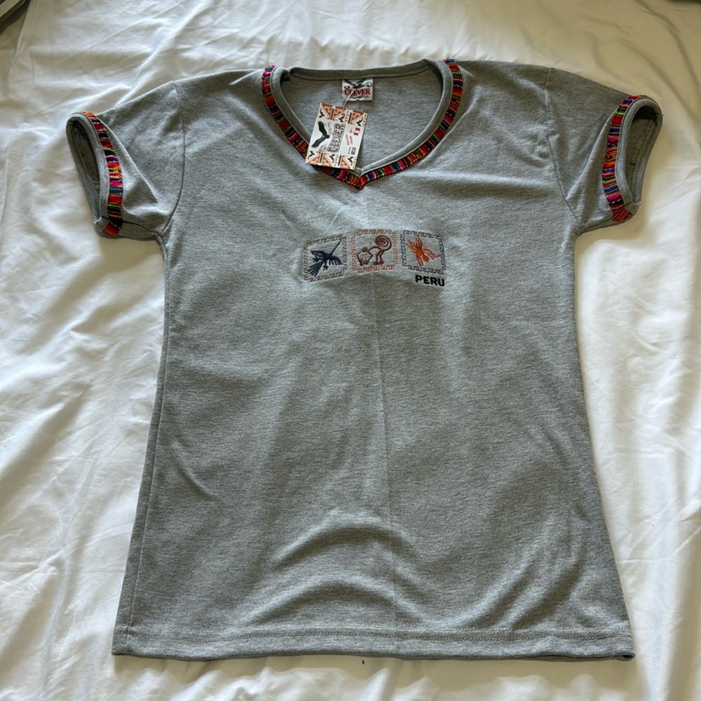 shirt has a different size because it is from Peru and comfortable 100% cotton